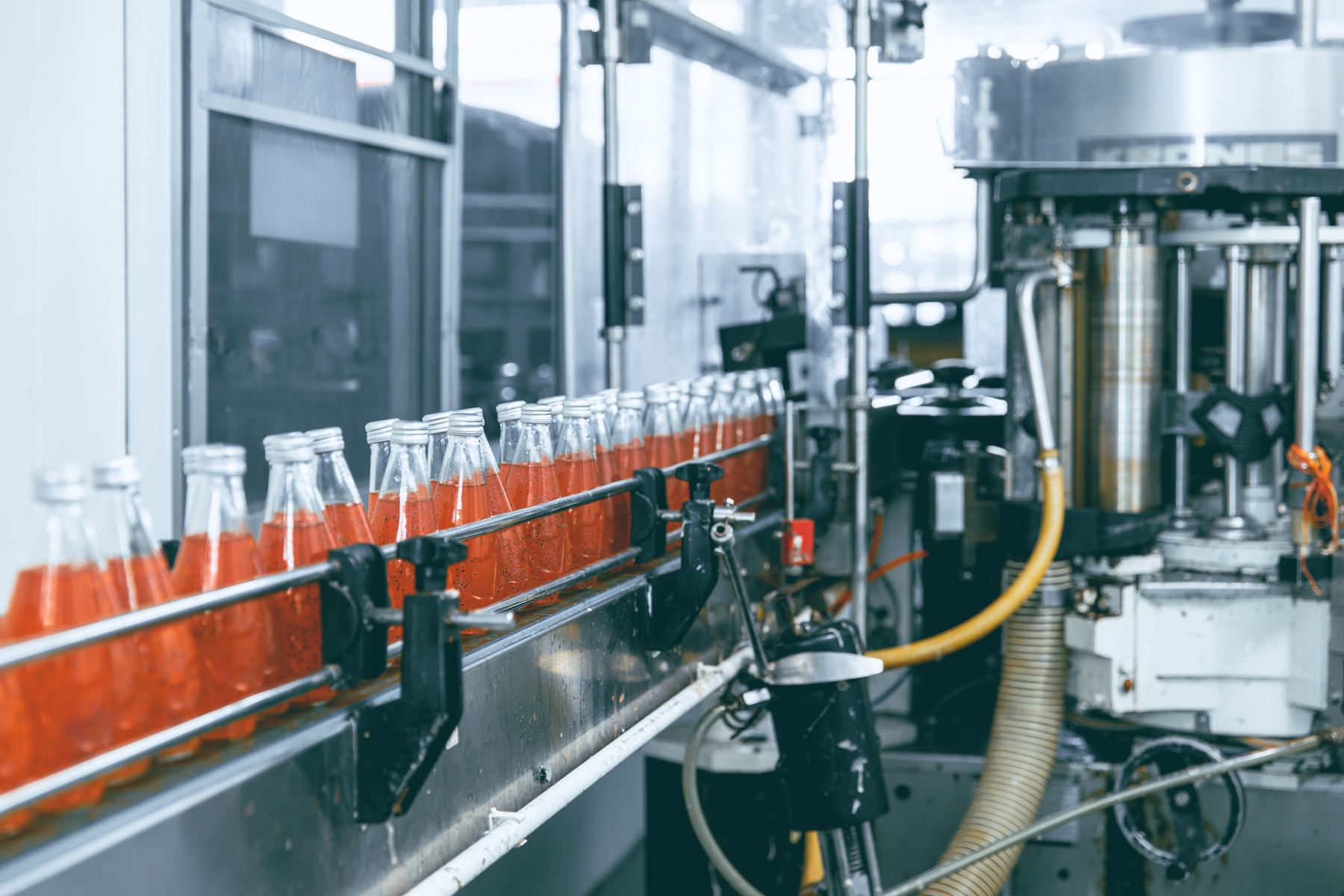Drink bottles moving into a capping machine